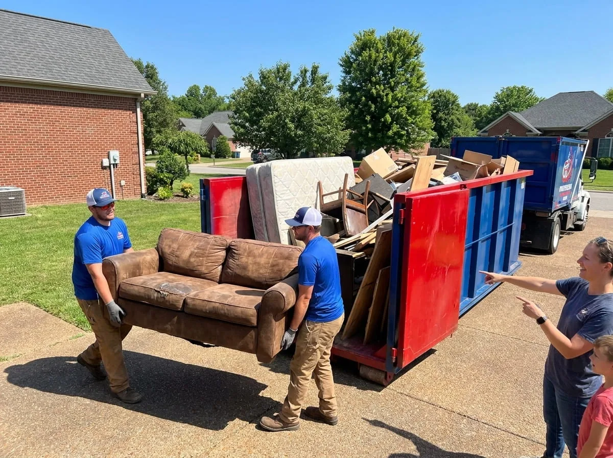 Owensboro Dumpster Rental Group roll-off truck delivering a dumpster